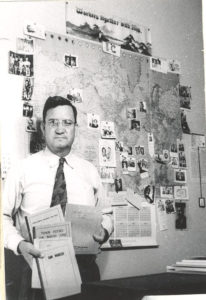 Homer Duncan with map and books